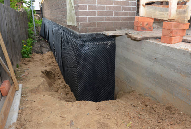 SJ Waterproofing Pros technician performing targeted Vapor Barrier Installation assessment in Port Washington, WI
